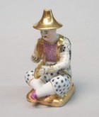 Флакон в виде играющего на тарелках китайца