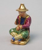 Флакон в виде играющего на тарелках китайца