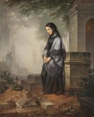 У свежей могилы